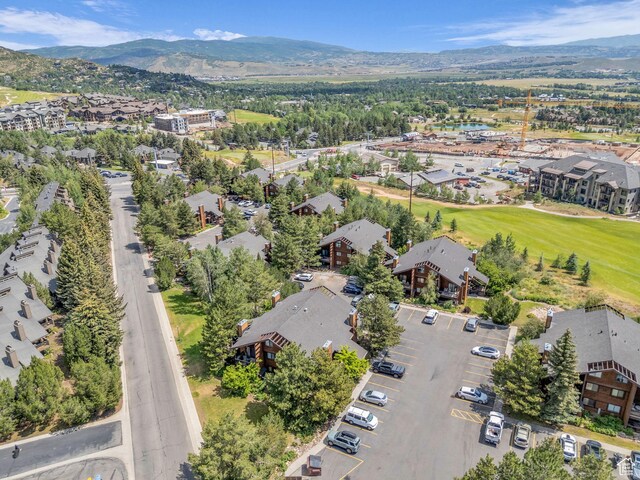 2025 Canyons Resort Dr Unit R8, Park City, UT 84060 - aerial view of property and surrounding area featuring nearby suburban area and a mountain backdrop
