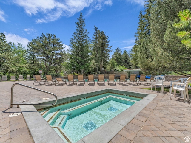 2025 Canyons Resort Dr Unit R8, Park City, UT 84060 - view of pool featuring a patio, a hot tub, and view of scattered trees