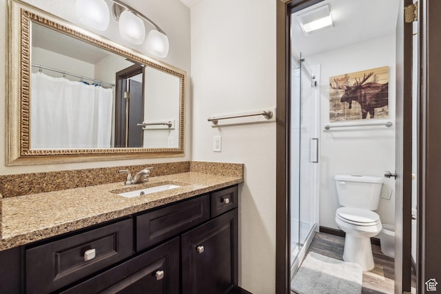 2025 Canyons Resort Dr Unit R8, Park City, UT 84060 - bathroom featuring vanity, toilet, wood finished floors, and a shower stall