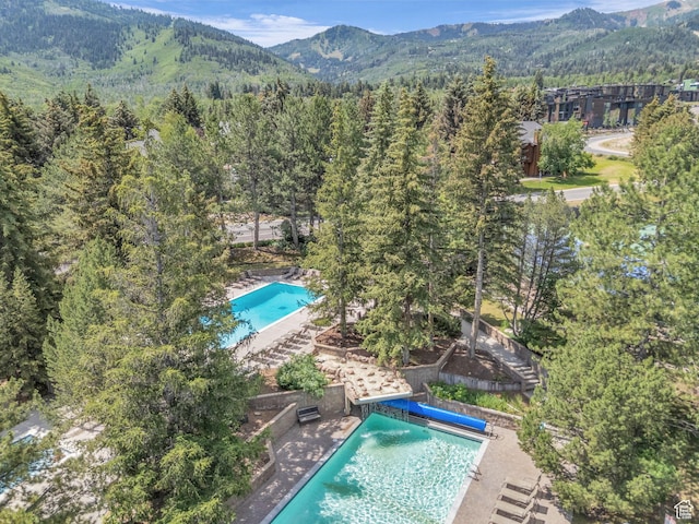 2025 Canyons Resort Dr Unit R8, Park City, UT 84060 - view of swimming pool featuring a mountain view and a wooded view