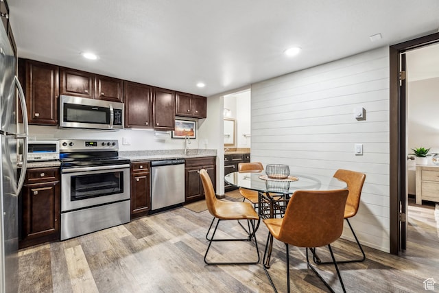 2025 Canyons Resort Dr Unit R8, Park City, UT 84060 - kitchen featuring light wood finished floors, recessed lighting, a sink, stainless steel appliances, and dark brown cabinetry
