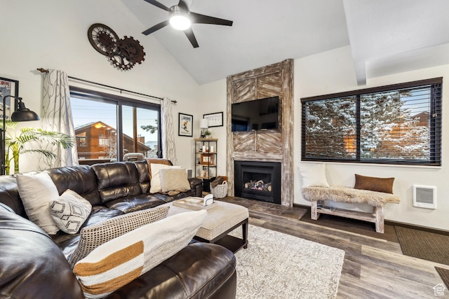 2025 Canyons Resort Dr Unit R8, Park City, UT 84060 - living area featuring high vaulted ceiling, a ceiling fan, a tiled fireplace, wood finished floors, and baseboards