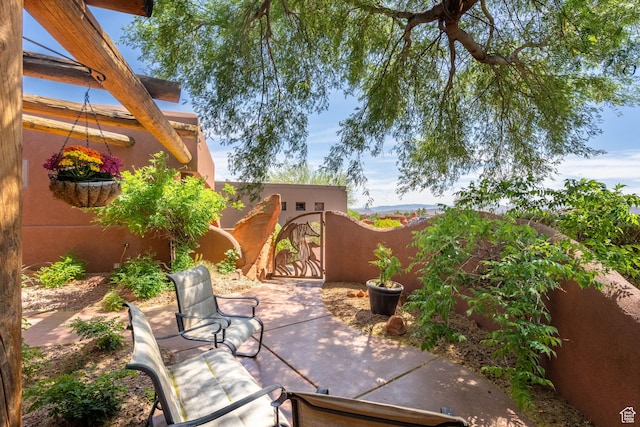 2336 W Entrada Trl Unit 44, St George, UT 84770 - view of patio / terrace featuring a gate