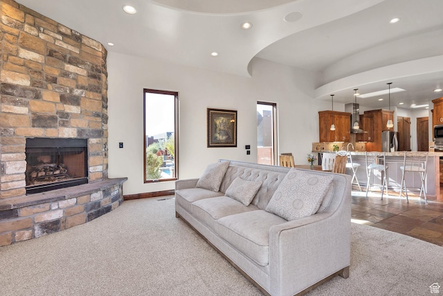 2336 W Entrada Trl Unit 44, St George, UT 84770 - living room with recessed lighting, carpet, a fireplace, and arched walkways
