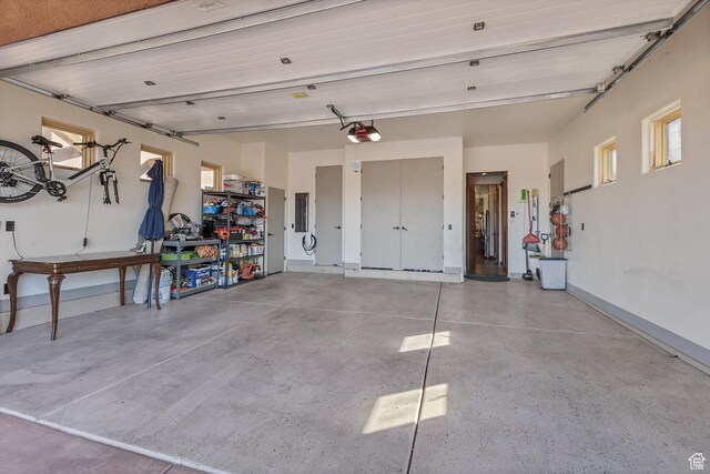 2336 W Entrada Trl Unit 44, St George, UT 84770 - garage with a garage door opener and baseboards