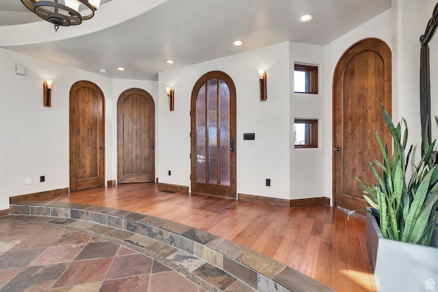 2336 W Entrada Trl Unit 44, St George, UT 84770 - entryway featuring arched walkways, baseboards, recessed lighting, and wood finished floors