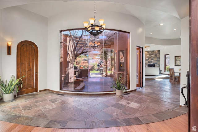 2336 W Entrada Trl Unit 44, St George, UT 84770 - entryway featuring stone tile flooring, a chandelier, baseboards, and recessed lighting