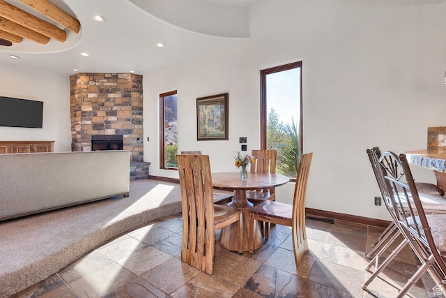 2336 W Entrada Trl Unit 44, St George, UT 84770 - dining space featuring stone tile flooring, recessed lighting, a fireplace, and baseboards