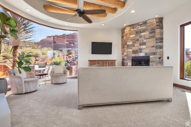 2336 W Entrada Trl Unit 44, St George, UT 84770 - carpeted living area with a stone fireplace, recessed lighting, a ceiling fan, and beam ceiling