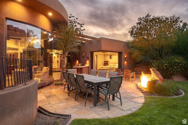 2336 W Entrada Trl Unit 44, St George, UT 84770 - view of patio / terrace featuring an outdoor fire pit and outdoor dining space