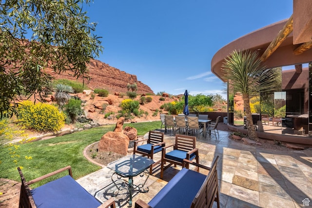 2336 W Entrada Trl Unit 44, St George, UT 84770 - view of patio / terrace featuring outdoor dining area, an outdoor hangout area, and a deck with mountain view