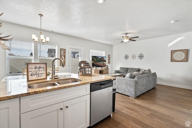 292 N 100 W, Morgan, UT 84050 - kitchen featuring a sink, dishwasher, ceiling fan with notable chandelier, white cabinets, and dark wood-style flooring