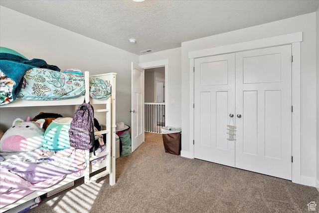 292 N 100 W, Morgan, UT 84050 - carpeted bedroom featuring a closet, visible vents, and a textured ceiling