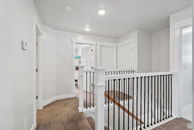 292 N 100 W, Morgan, UT 84050 - hall featuring an upstairs landing, baseboards, carpet floors, and a textured ceiling