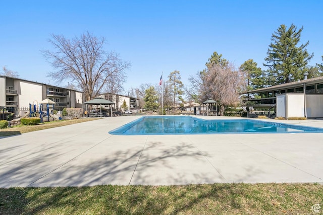 5809 S Waterbury Dr Unit D, Murray, UT 84121 - outdoor pool with a gazebo, a patio area, and fence