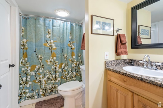 5809 S Waterbury Dr Unit D, Murray, UT 84121 - full bathroom featuring a shower with curtain, toilet, and vanity