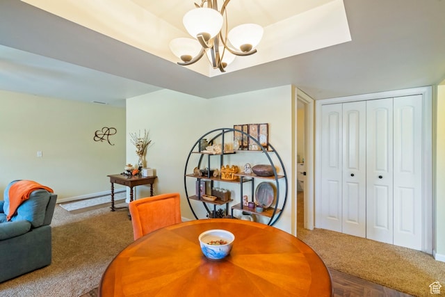 5809 S Waterbury Dr Unit D, Murray, UT 84121 - dining area with carpet flooring, a notable chandelier, and baseboards