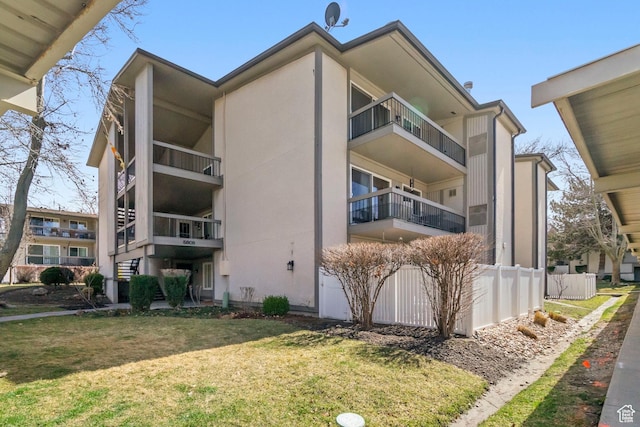 5809 S Waterbury Dr Unit D, Murray, UT 84121 - view of building exterior featuring fence