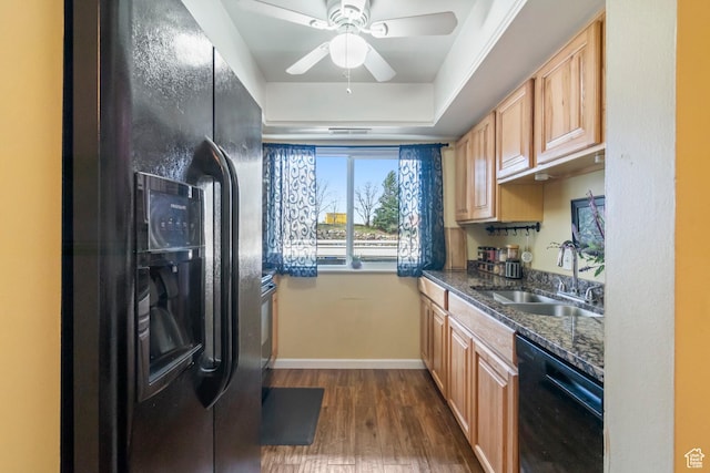5809 S Waterbury Dr Unit D, Murray, UT 84121 - kitchen with dark stone countertops, baseboards, a sink, black appliances, and dark wood-type flooring