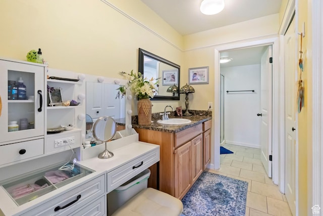 5809 S Waterbury Dr Unit D, Murray, UT 84121 - bathroom featuring tile patterned floors, vanity, and walk in shower