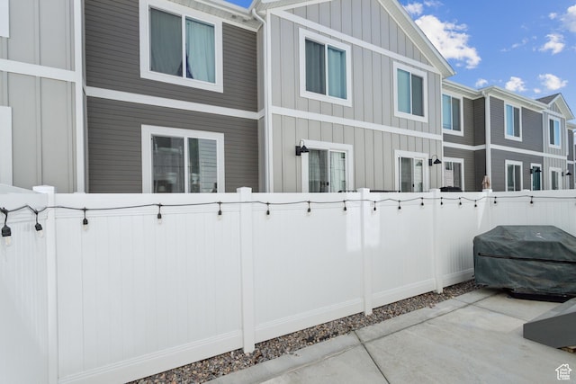 1722 E Muss Dr, Eagle Mountain, UT 84005 - exterior space with a fenced backyard and board and batten siding