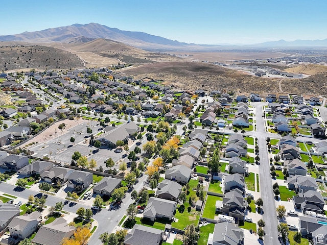 view of property location with mountains and nearby suburban area
