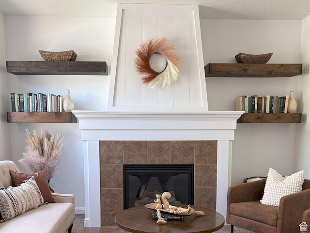 detailed view of a tiled fireplace and carpet flooring