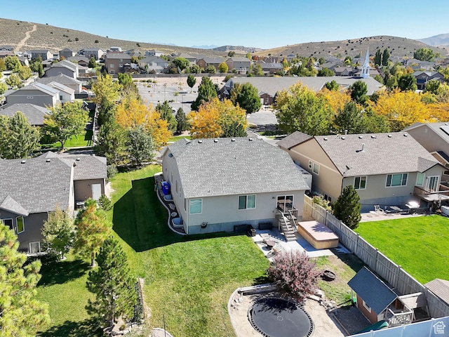 aerial view of residential area featuring a mountainous background
