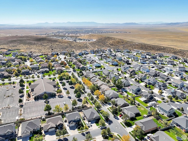 aerial overview of property's location with mountains and nearby suburban area