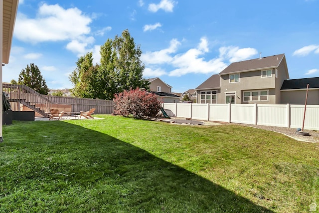view of yard featuring a fire pit, stairs, and a residential view