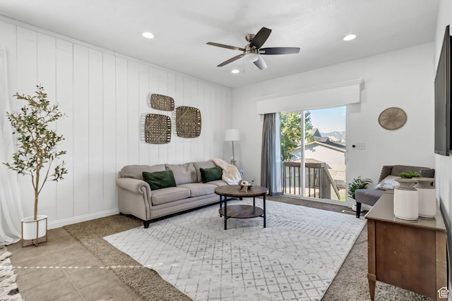 living area with recessed lighting, a ceiling fan, and baseboards