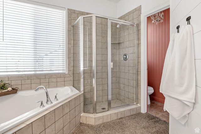 full bath with a shower stall, a garden tub, and toilet