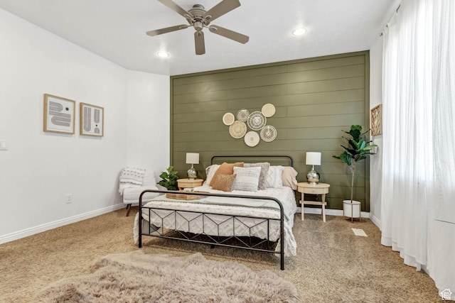 carpeted bedroom featuring baseboards, recessed lighting, and a ceiling fan