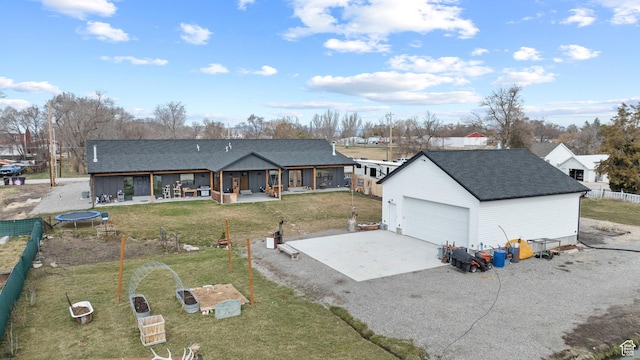 2386 N 3900 W, Corinne, UT 84307 - exterior space featuring an outbuilding, a shingled roof, gravel driveway, and a trampoline