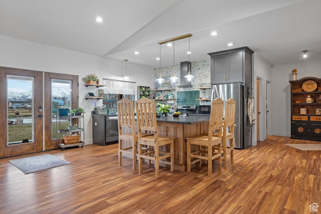 2386 N 3900 W, Corinne, UT 84307 - dining space with vaulted ceiling, recessed lighting, and light wood-type flooring