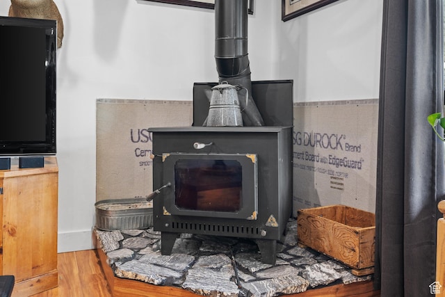 2386 N 3900 W, Corinne, UT 84307 - interior details featuring a wood stove and wood finished floors