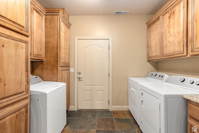 1815 N Red Mountain Dr, Santa Clara, UT 84765 - clothes washing area featuring washing machine and clothes dryer, visible vents, and cabinet space
