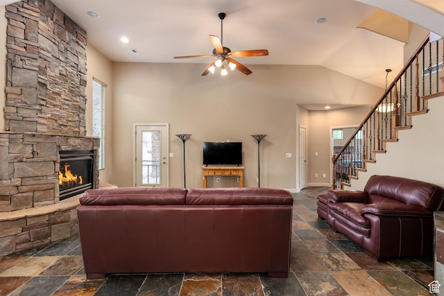 1815 N Red Mountain Dr, Santa Clara, UT 84765 - living area featuring stone tile floors, a fireplace, and a ceiling fan