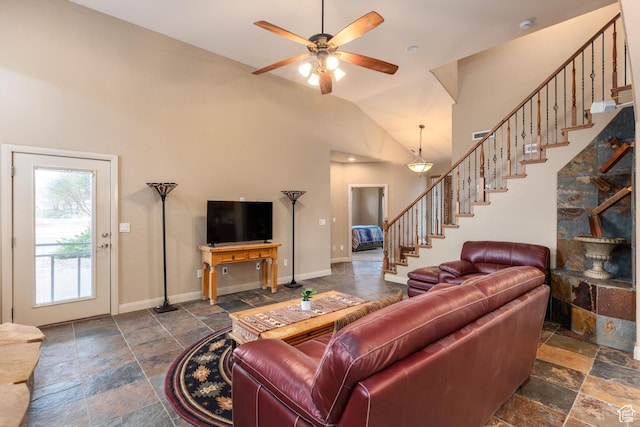 1815 N Red Mountain Dr, Santa Clara, UT 84765 - living area featuring stairs, a ceiling fan, baseboards, and stone tile flooring