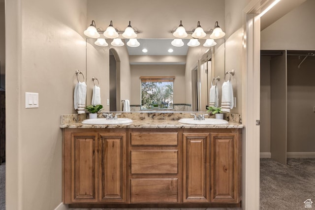 1815 N Red Mountain Dr, Santa Clara, UT 84765 - bathroom featuring a sink, baseboards, and double vanity