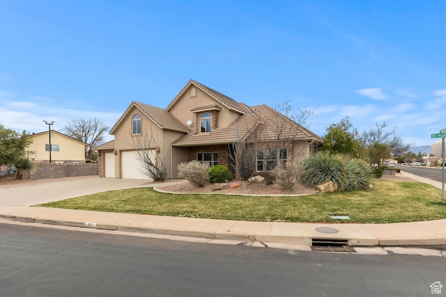 1815 N Red Mountain Dr, Santa Clara, UT 84765 - view of front of property featuring stucco siding, concrete driveway, a front lawn, a garage, and a tiled roof