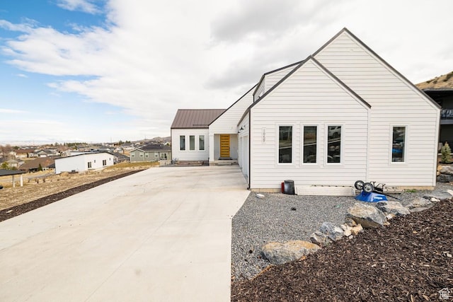 1959 E Deer Crest Cir N, Logan, UT 84341 - modern farmhouse style home with driveway and metal roof