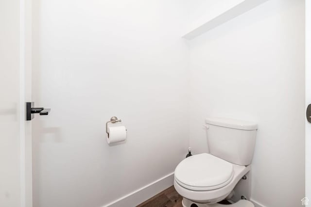 1959 E Deer Crest Cir N, Logan, UT 84341 - bathroom with toilet, baseboards, and wood finished floors