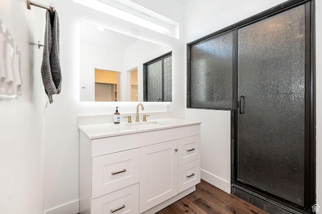 1959 E Deer Crest Cir N, Logan, UT 84341 - bathroom with baseboards, vanity, wood finished floors, and a shower stall