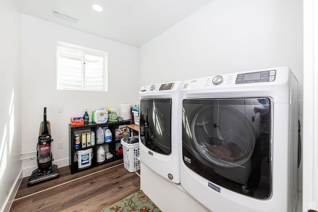 1959 E Deer Crest Cir N, Logan, UT 84341 - clothes washing area with baseboards, washing machine and dryer, wood finished floors, and laundry area