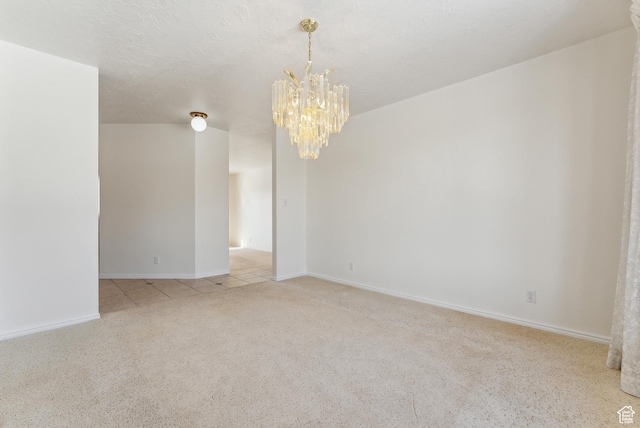 3902 W Angus Dr, South Jordan, UT 84009 - spare room with a chandelier, light colored carpet, and baseboards