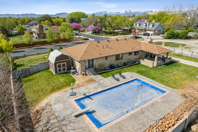 3902 W Angus Dr, South Jordan, UT 84009 - view of pool with a shed, an outdoor structure, a mountain view, and a patio