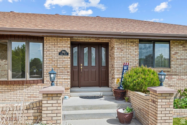 3902 W Angus Dr, South Jordan, UT 84009 - property entrance featuring brick siding and roof with shingles
