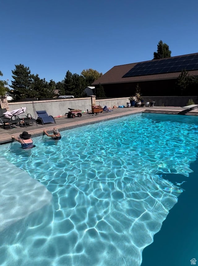 3902 W Angus Dr, South Jordan, UT 84009 - view of swimming pool featuring a diving board and a patio