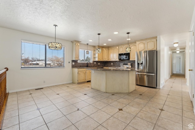 3902 W Angus Dr, South Jordan, UT 84009 - kitchen with stainless steel appliances, a center island, decorative backsplash, baseboards, and a sink